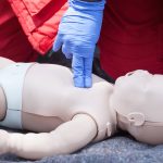 baby-cpr-dummy-first-aid-training-heart-massage-picture-id637922768