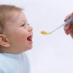 Portrait of Baby Being Fed