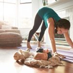 keeping-an-eye-on-her-baby-while-keeping-in-shape-picture-id628295056
