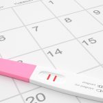pregnancy-test-on-calendar-picture-id514155860