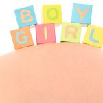pregnant-belly-with-the-words-girl-and-boy-picture-id184601409