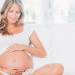 pregnant-woman-relaxing-on-living-room-picture-id523965187