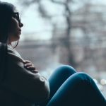 teenage-girl-looking-out-the-window-picture-id507633450