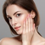 young-beautiful-woman-face-portrait-on-gray-background-picture-id515855680