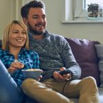 couple-at-home-watching-tv-picture-id638349224