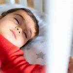 detail-of-a-baby-napping-in-the-crib-one-year-old-caucasian-boy-to-picture-id1386255493