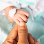 small-delicate-little-hand-of-newborn-close-portrait-picture-id1326960427