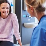 female-patient-and-nurse-have-consultation-in-hospital-room-picture-id489303654