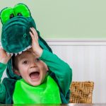 cute-child-in-crocodile-suit-picture-id489429564