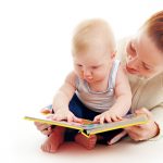 Mother and Baby Reads Book Isolated On White