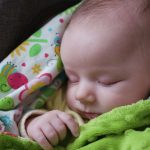baby-sleeping-in-a-pram-picture-id952531242