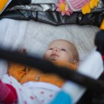 portrait-of-an-adorable-baby-girl-lying-on-her-back-picture-id948563388