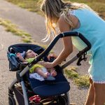 Mother and newborn baby on sunset