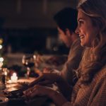 beautiful-woman-having-christmas-dinner-with-family-picture-id863577820