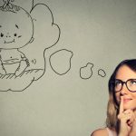 portrait-woman-thinking-dreaming-of-a-child-picture-id488054692