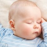 baby-sleeping-covered-with-soft-blanket-picture-id639510480
