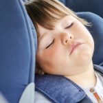 tired-little-baby-boy-sleeping-in-car-seat-traveling-with-parents-picture-id1168187022 (1)