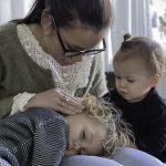 Mother with her sick children