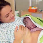 happy-mom-having-her-baby-skin-to-skin-first-seconds-after-birth-picture-id906740446