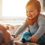 happy-baby-boy-having-fun-with-his-dad-picture-id1306668118