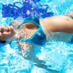 Happy pregnant woman in water