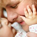 Happy Father Loving Newborn Baby Girl