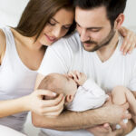 Happy family with newborn baby
