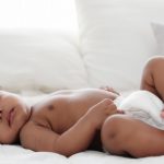 portrait-of-african-american-baby-girl-sleeping-on-white-bed-picture-id1198530700
