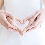 couple-hands-making-heart-shape-picture-id1132939709