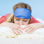 young-woman-wearing-sleeping-eye-band-in-bed-picture-id1291545481