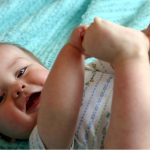 baby-playing-with-toes-picture-id89958706