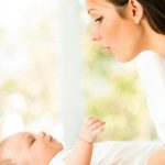young-mother-playing-with-three-months-old-baby-boy-picture-id474108810