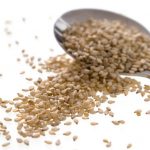 sesame-seeds-and-small-serving-spoon-picture-id172875724