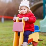cute-toddler-girl-having-fun-on-playground-happy-healthy-little-child-picture-id1302618466