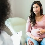 expectant-mother-touches-abdomen-while-listening-to-unrecognizable-doctor.jpg_s=1024×1024&w=is&k=20&c=gib_sDeI6i8hLS-j-HwUK2aMFXr6s7EtTkKiS0sP7O0=