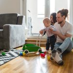 Young parents playing with baby