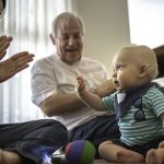 Grandparents playing with grandson