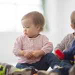 Diverse group of babies playing together