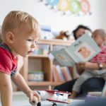 Little boy playing in a classroom