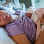 Woman Giving Birth in the Maternity Ward The First Seconds of Newborn Life in the Hospital